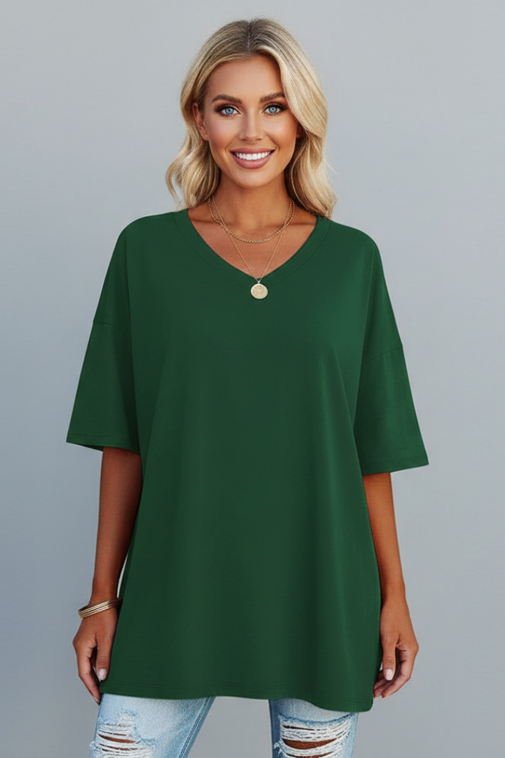 Modl in essential green tee front view gray background