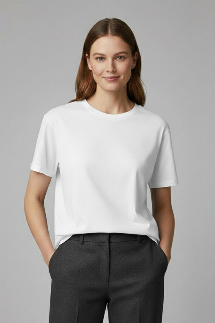Oversized plain white top shown in clean studio lighting