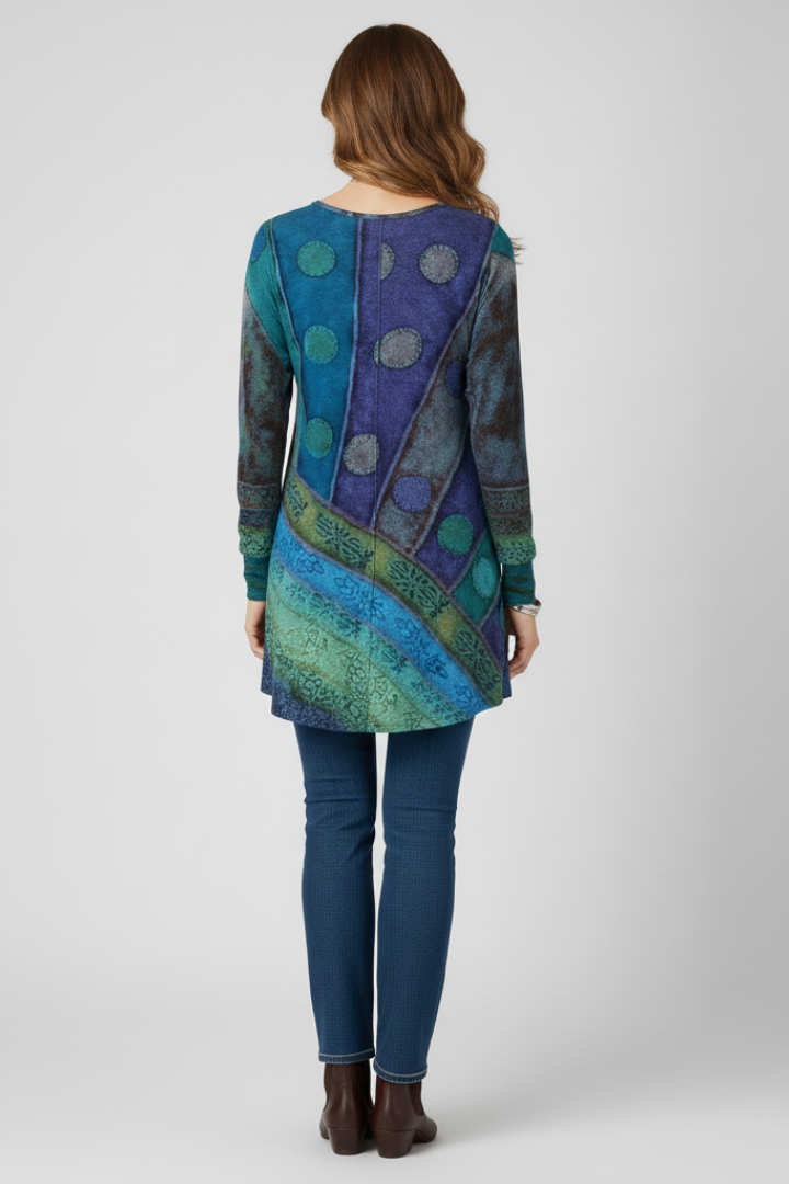 Back angle straight hem tunic with patchwork design and blue pants