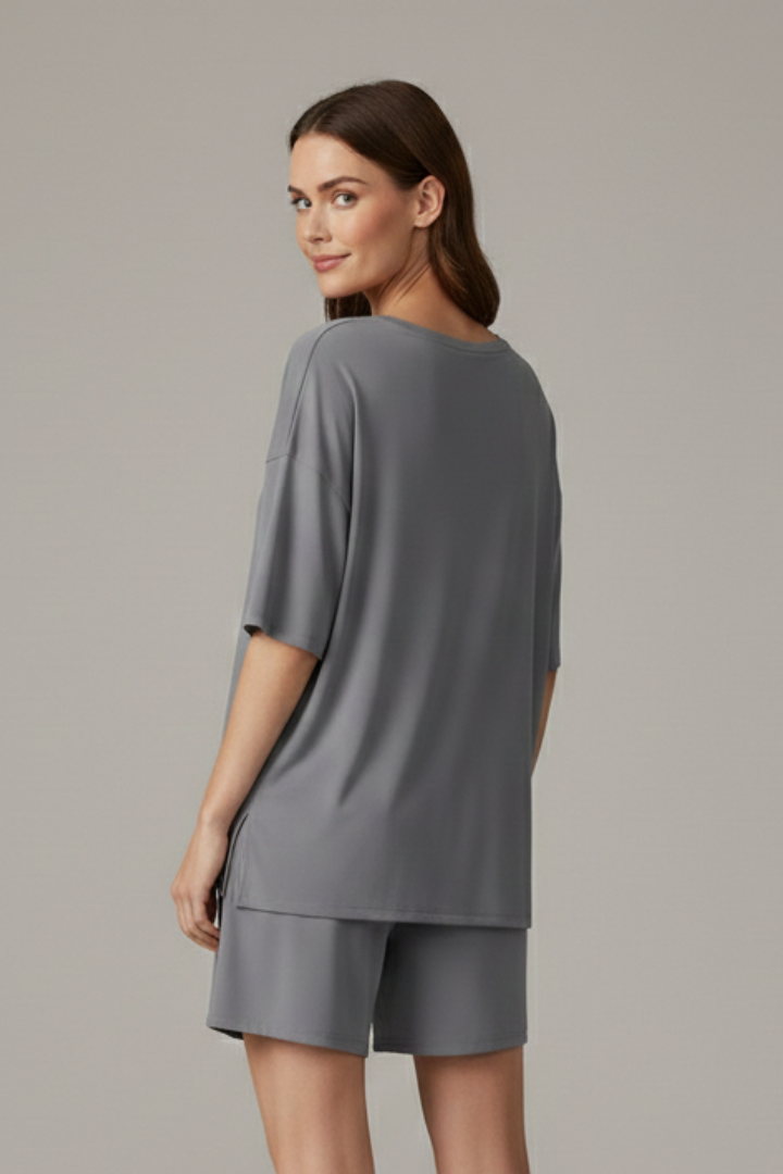 Model standing loose fit outfit back view angle