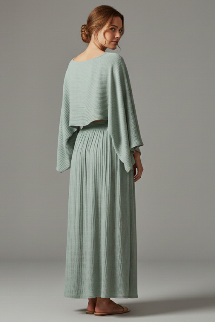 Model posing in matching textured skirt set