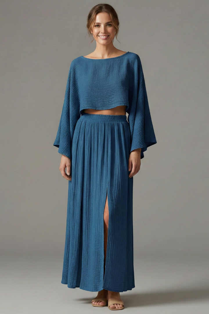 Female model standing in cropped top and maxi
