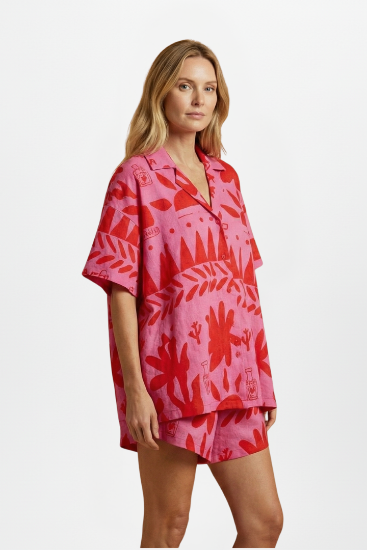 Model standing pose wearing summer set on plain gray background