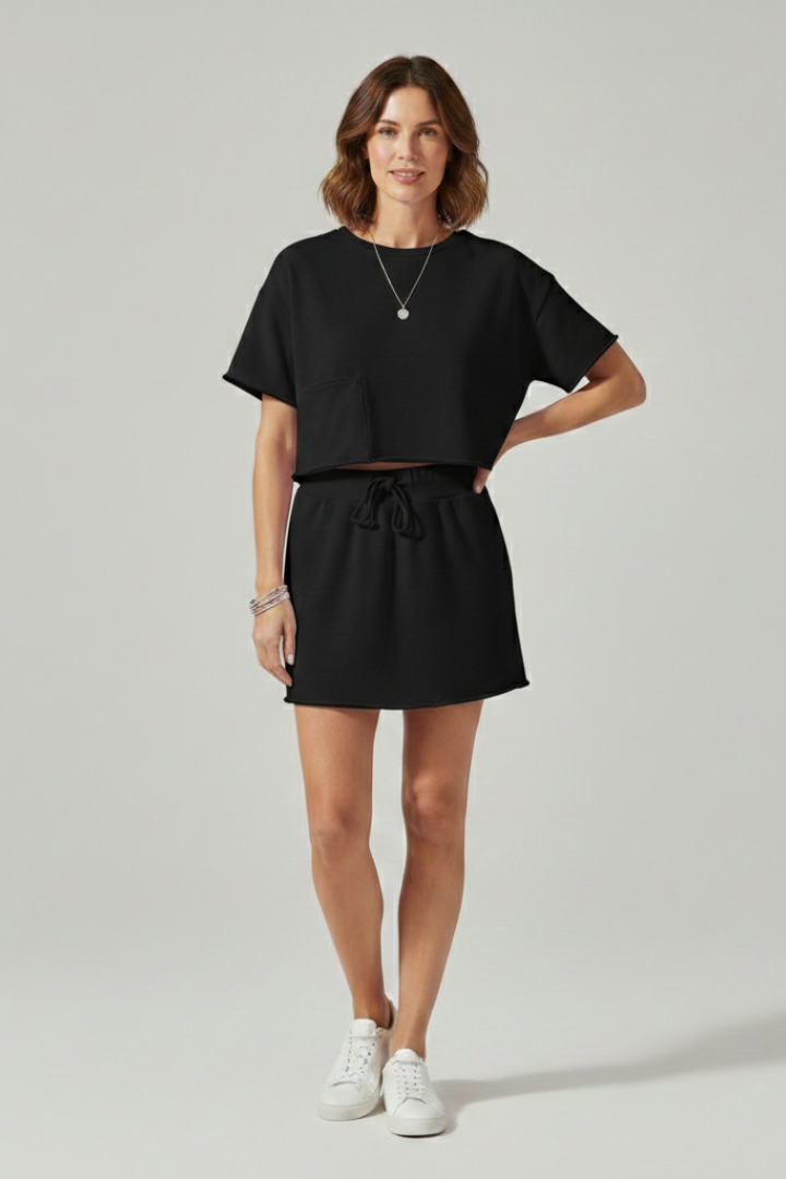 Model wearing plain summer black complete set outfit 
