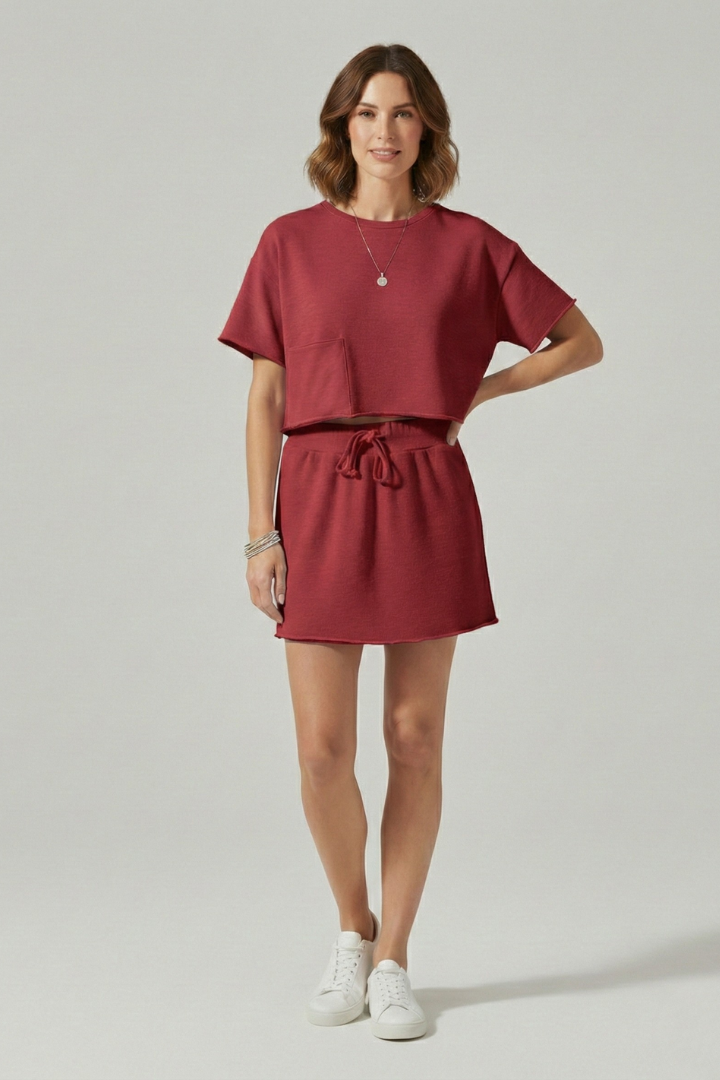 Gray background model wearing casual co-ord outfit