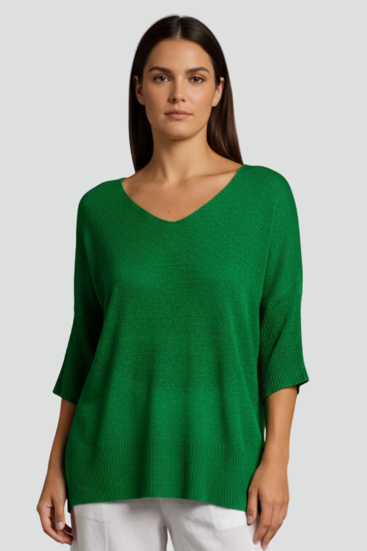 Front pose model wearing textured V-neck blouse in green color