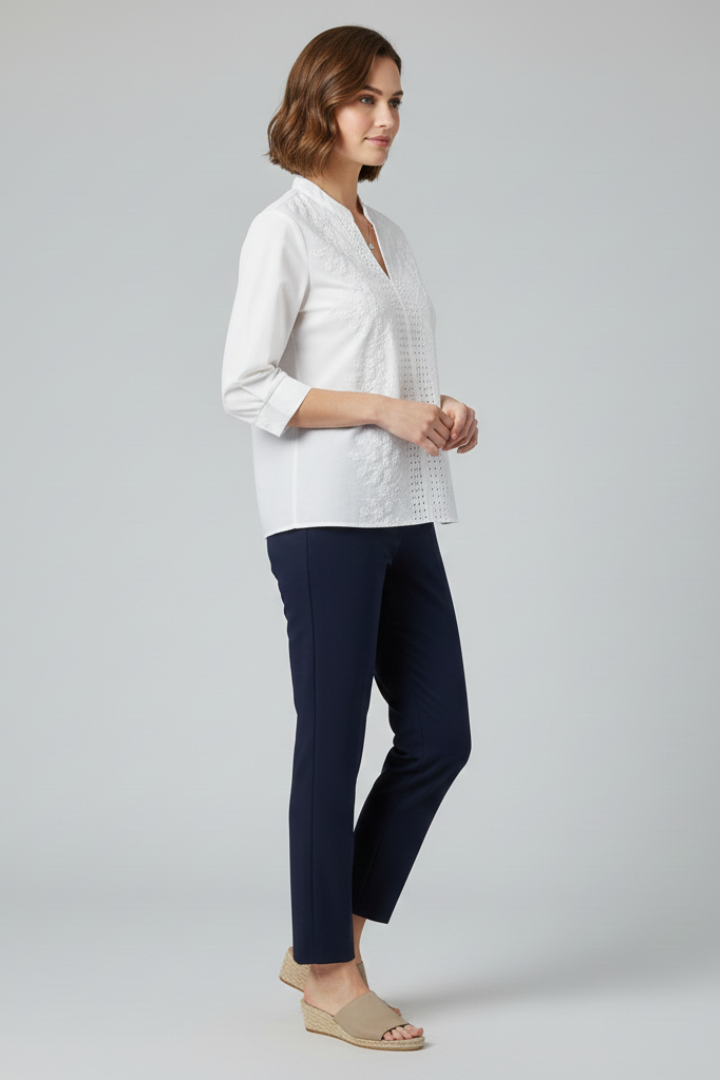 Front full length image of model in white blouse with black pants