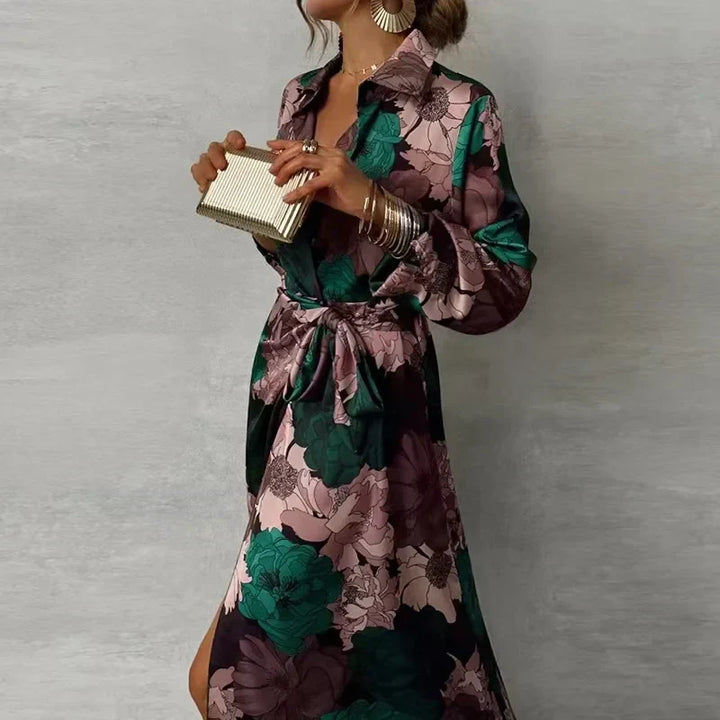 Female wearing a dark green floral maxi shirt dress on a plain background.