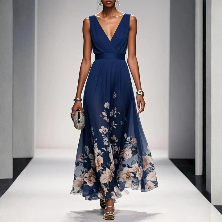 Female wearing a floral print V-neck maxi dress on a plain background.