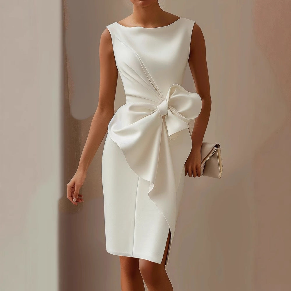 Woman posing in a fitted sleeveless midi dress with draped detailing on a plain background.