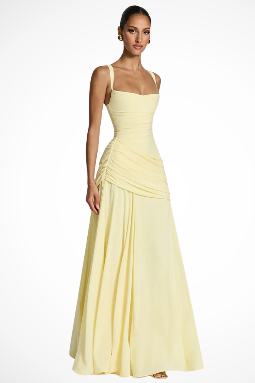 Woman wearing a formal sleeveless maxi dress with flowing skirt detail against a plain background.