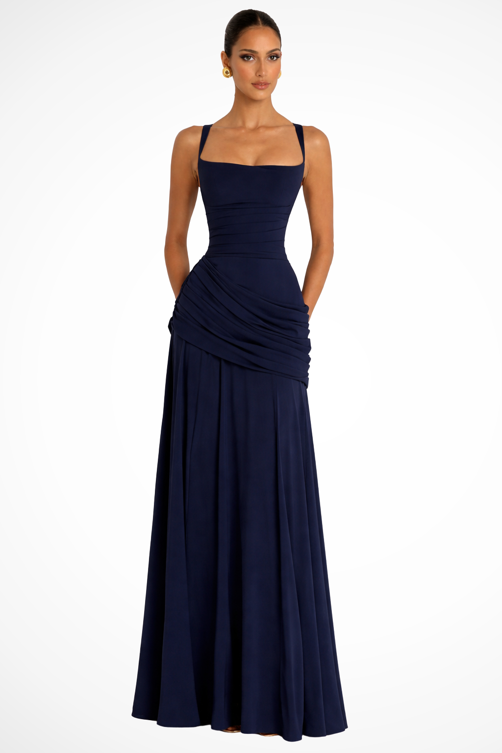 Female model in a ruched square neck evening gown displayed on a plain background.