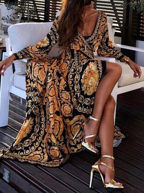 Woman model in an elegant bohemian maxi dress with long sleeves on a clean background.