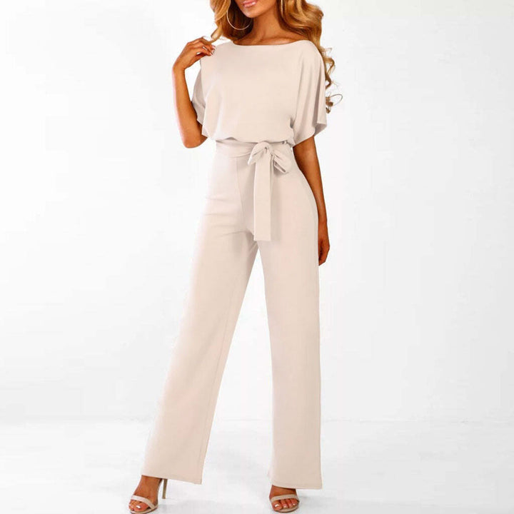Model walking pose highlighting flowy legs outfit plain background setup