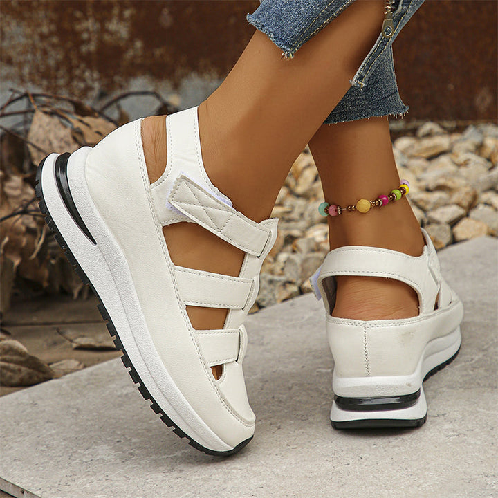 Outdoor lifestyle image of white strappy shoes