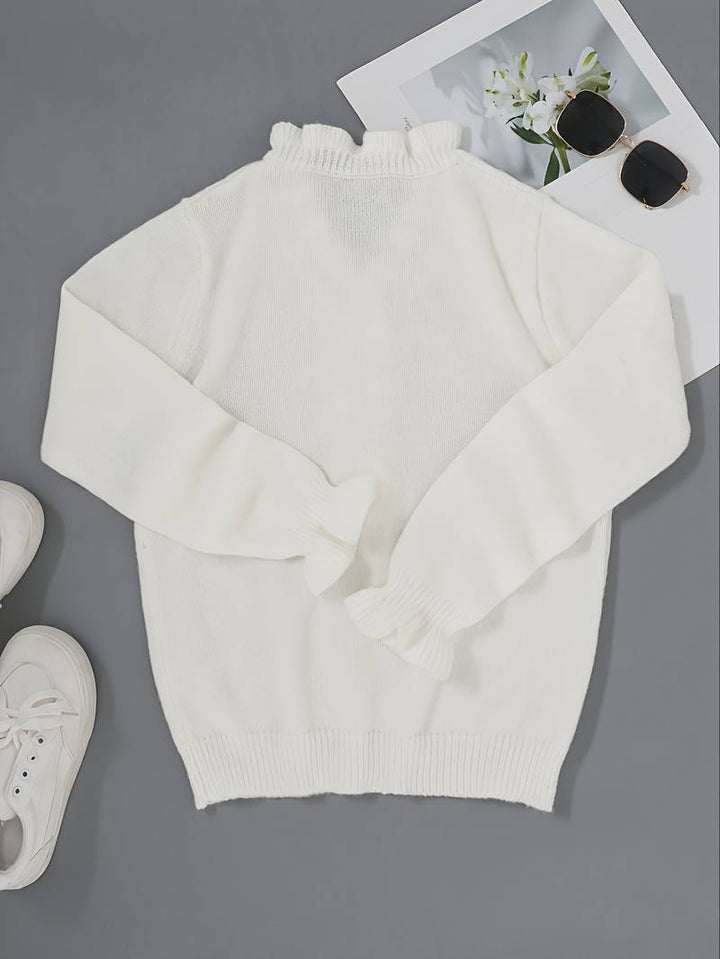 Elegant ruffle blouse displayed on a clean plain background with decorative button details, back view