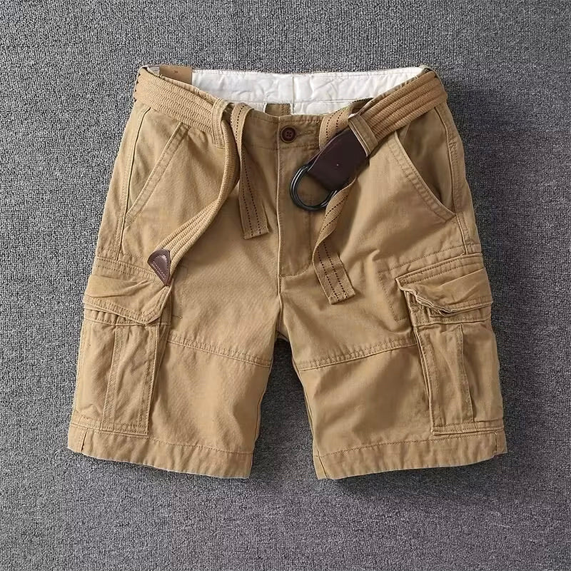 Male model wearing cargo pants against a plain background.