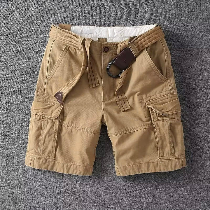 Male model wearing cargo pants against a plain background.