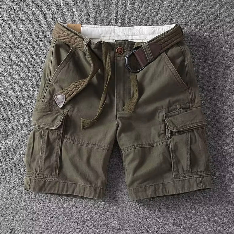  Man in relaxed cargo pants shown on a plain background.