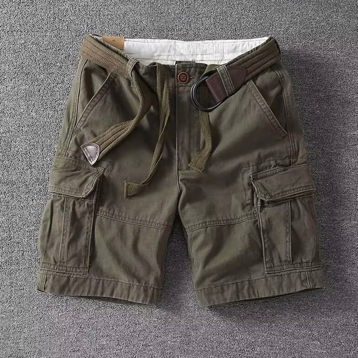  Man in relaxed cargo pants shown on a plain background.