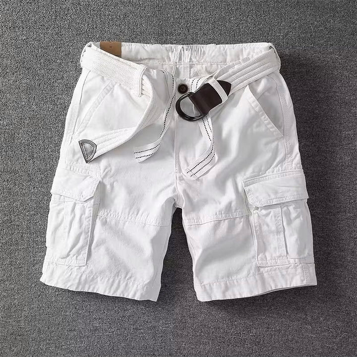  Male model styling everyday cargo pants with a clean look.