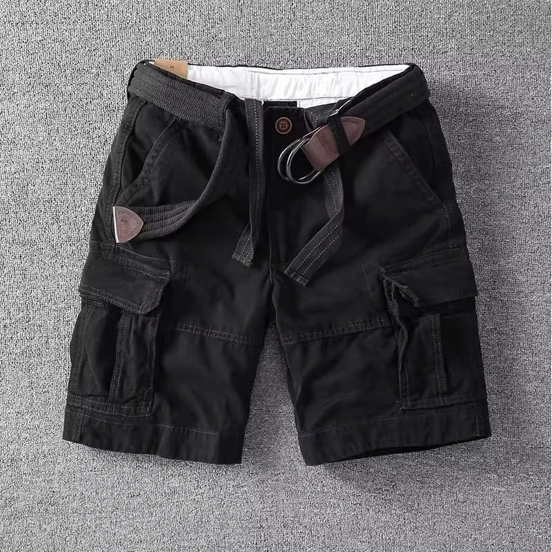  Male model in casual cargo pants with side pocket details.