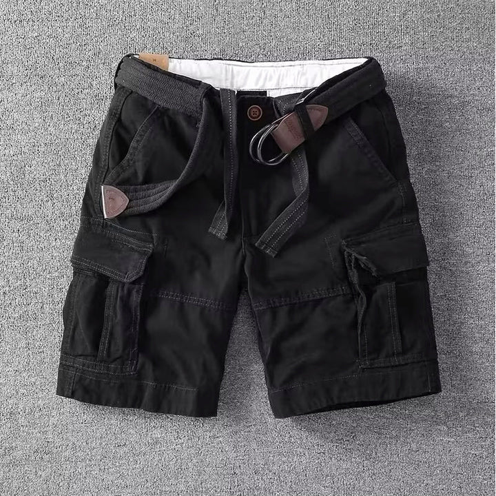  Male model in casual cargo pants with side pocket details.