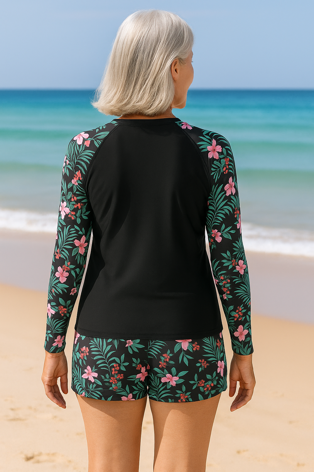 Female model in lightweight swimwear standing on a plain background,back view
