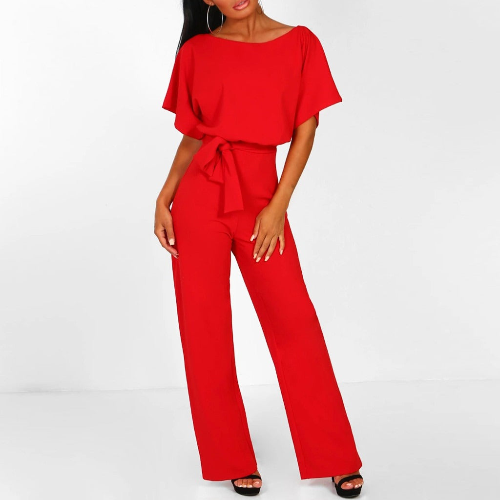Model casual pose slightly angled showing outfit plain background simple