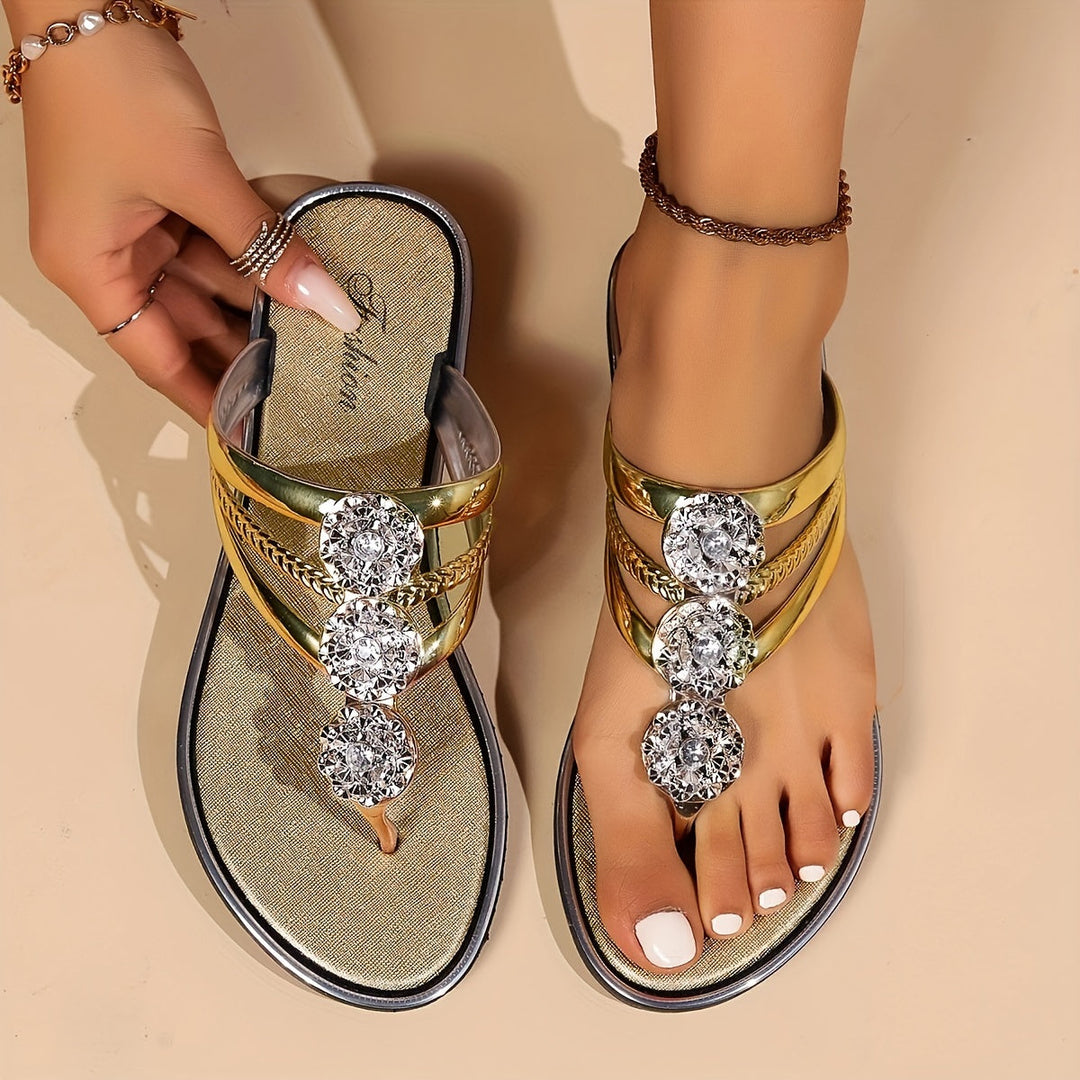  Female model displaying stylish open-toe sandals on a plain background.