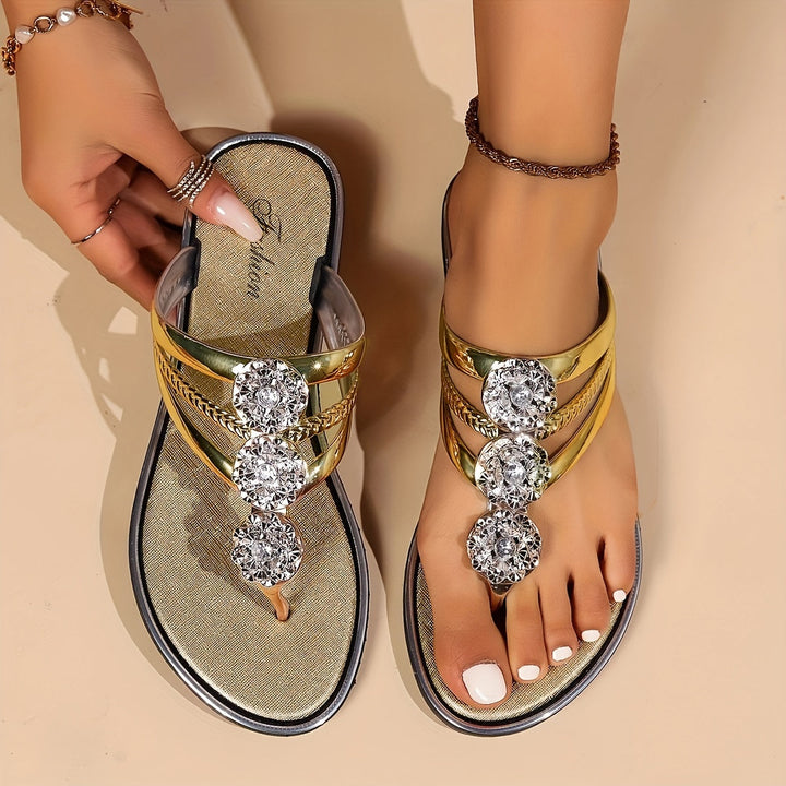  Female model displaying stylish open-toe sandals on a plain background.