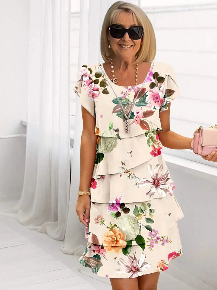 Pretty pink layered dress with delicate floral texture