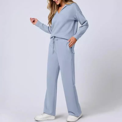 Model wearing a casual matching outfit with clean lines on a plain background.