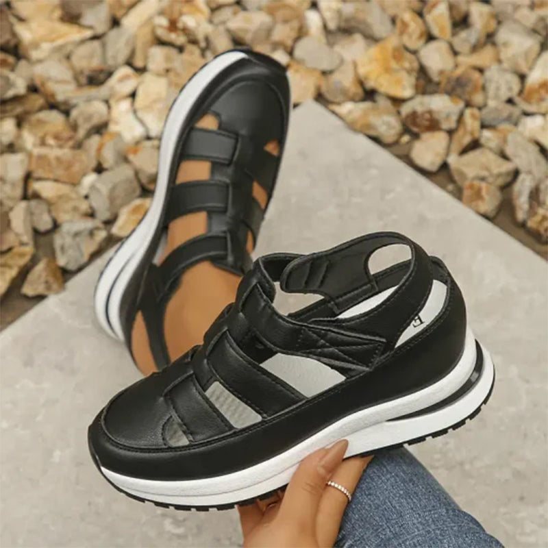 Black platform sneakers with thick white sole