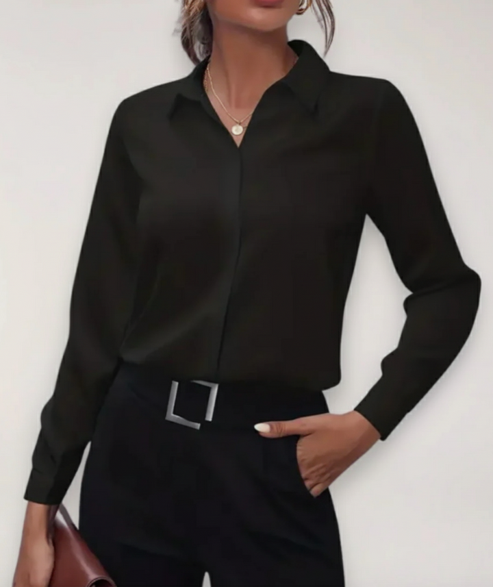 Polished summer office blouse featuring a structured front and clean neckline.