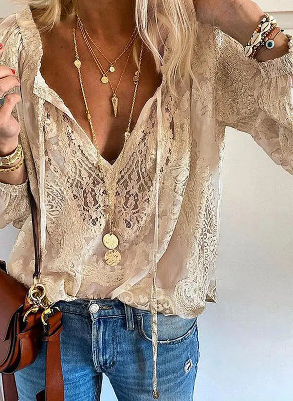 Woman styled in an elegant boho blouse for summer wear.