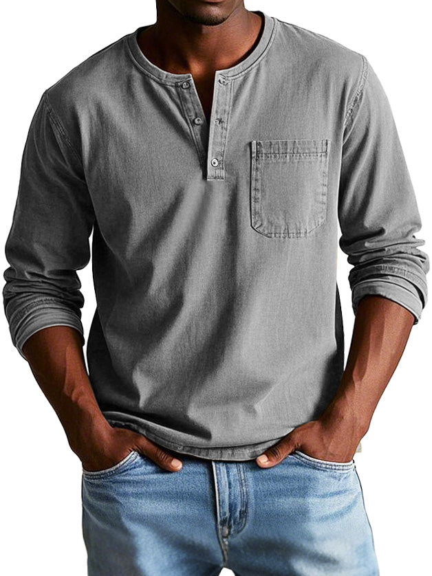 Model wearing a casual long sleeve Henley shirt on a plain background.