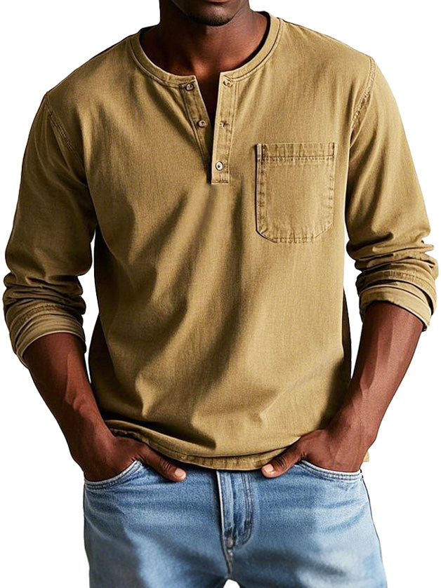 Model wearing a simple casual Henley shirt with chest pocket on a plain background.