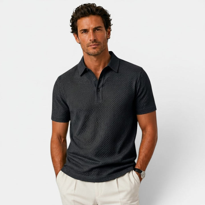  Model wearing a refined polo shirt with a polished fit.