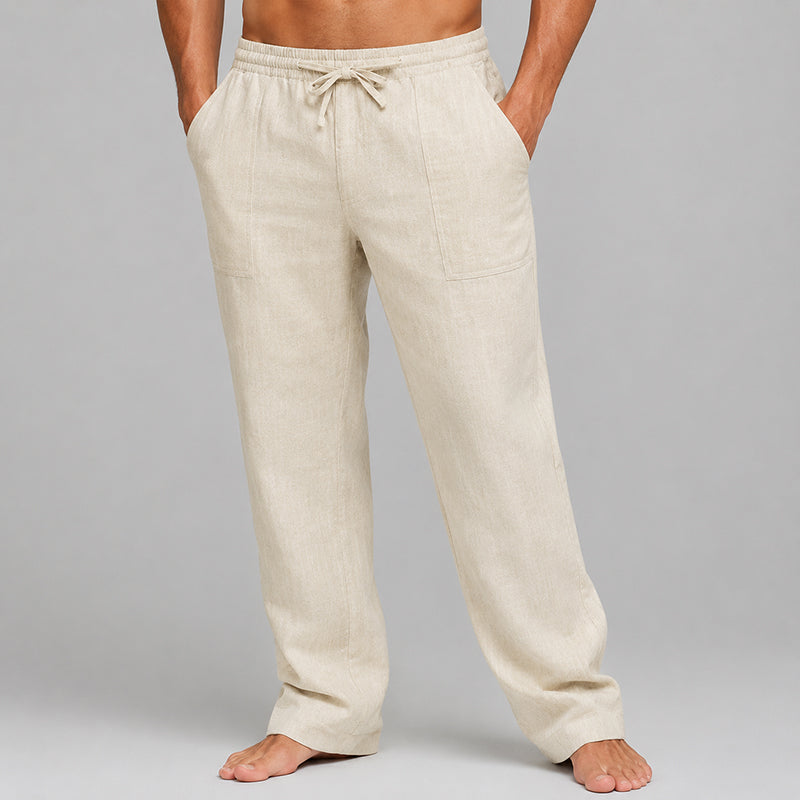 Model wearing relaxed men’s linen blend pants on a plain background.
