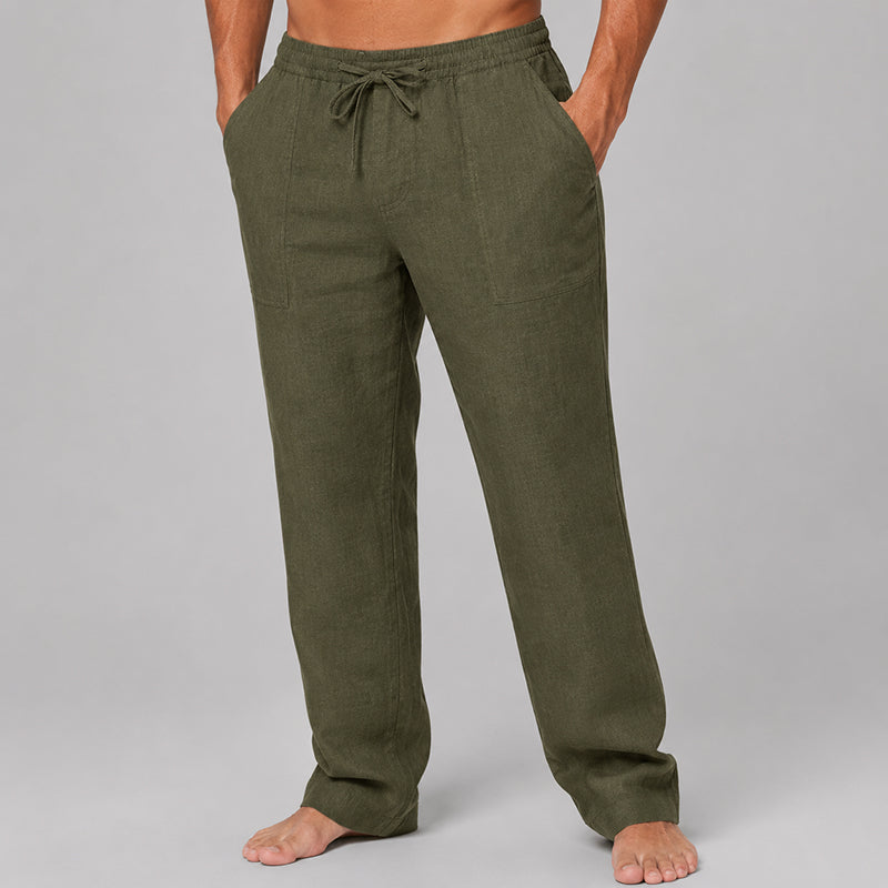  Model wearing men’s casual linen blend pants with soft drape on a plain background.