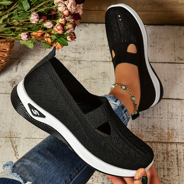 Minimal black footwear with soft stretch knit material