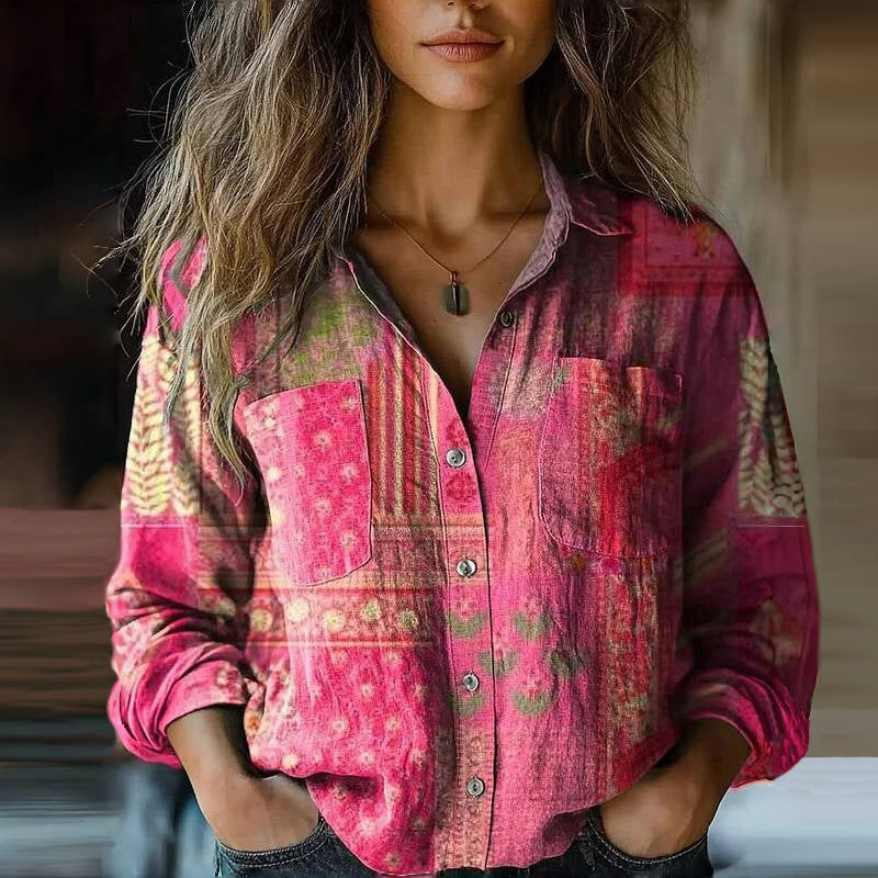 Female model wearing a casual printed long sleeve shirt against a clean background.