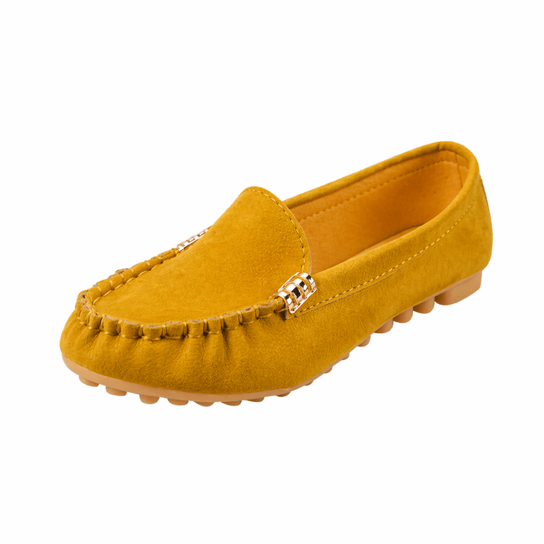 Versatile loafers with a clean casual look on a plain background.
