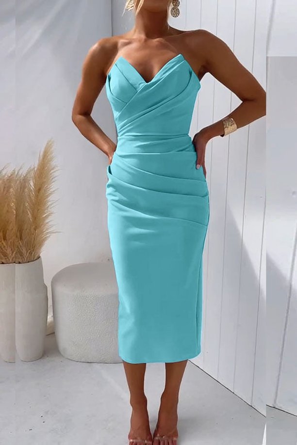  Female wearing a sophisticated occasion dress with a draped bodice on a plain background.