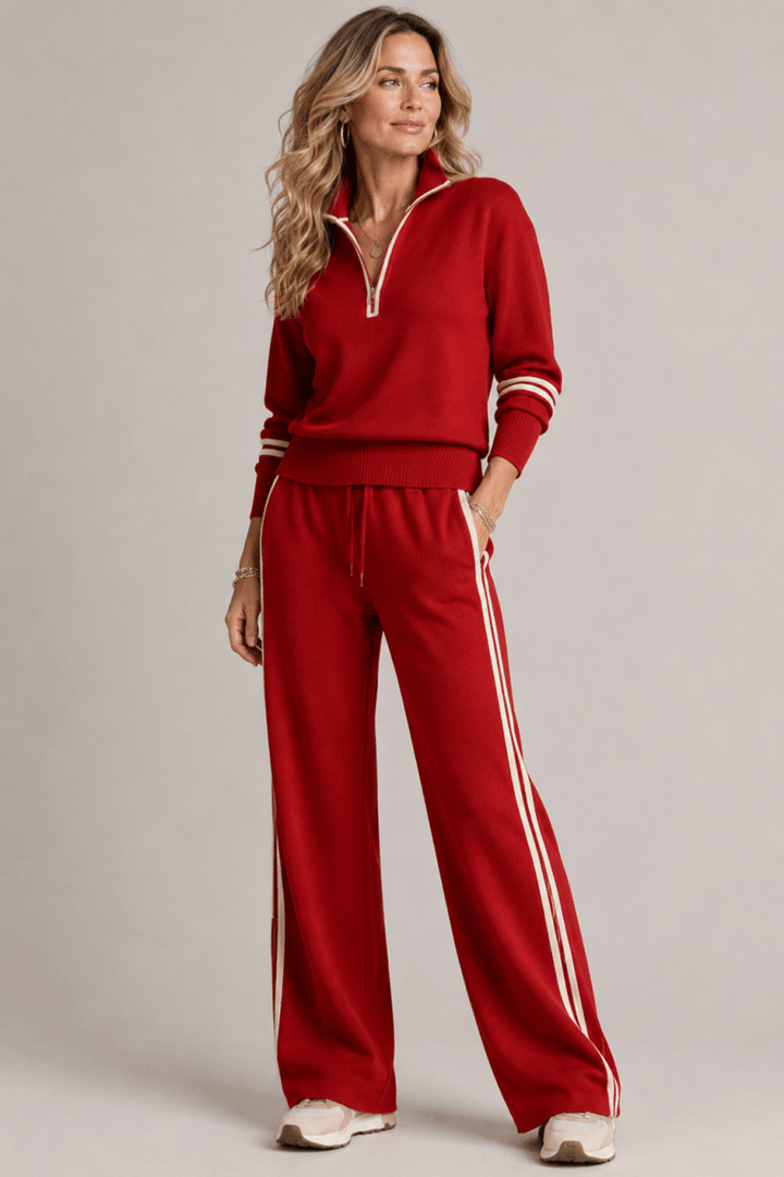  Model wearing a modern matching set with relaxed trousers on a plain background.