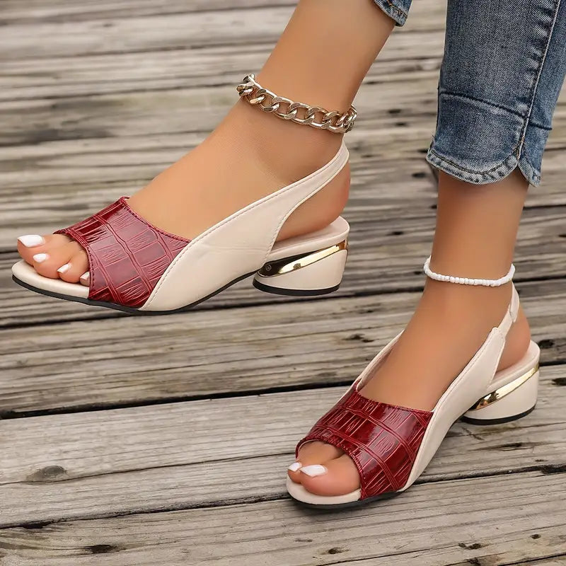  Female model showcasing open-toe sandals with adjustable straps on a plain background.