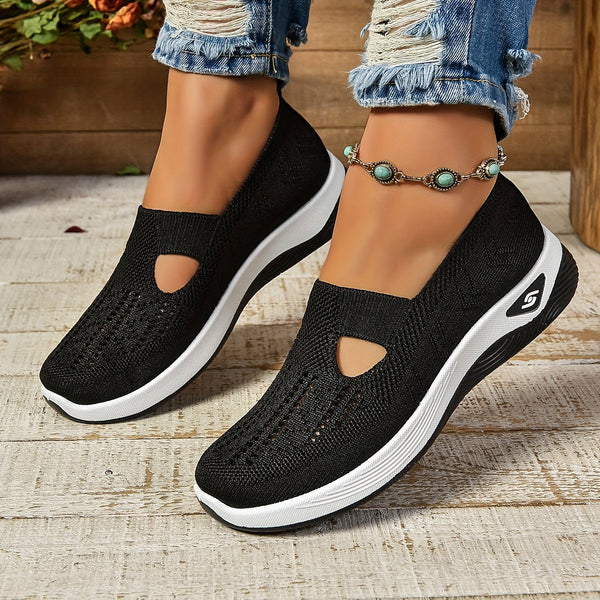 Casual black footwear product display on nature wooden background