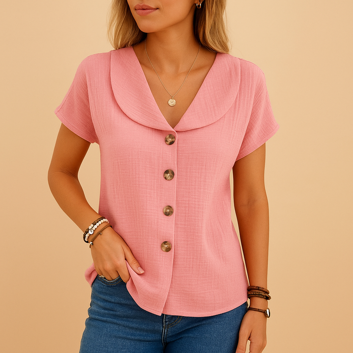 Pink blouse isolated on plain neutral tone background