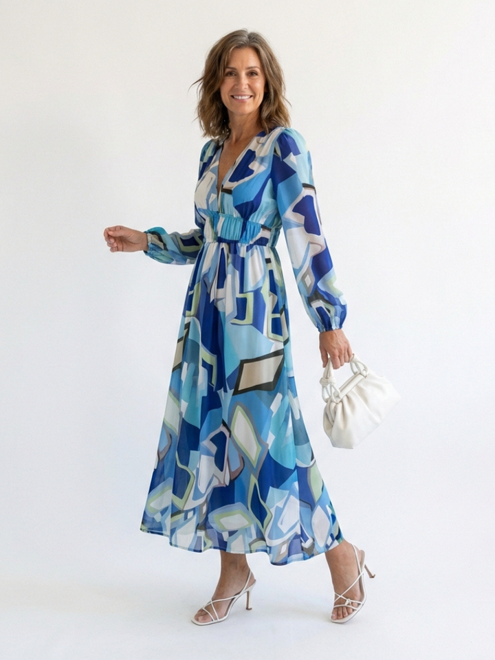 Female model wearing a green floral v neck maxi dress for warm-weather styling.